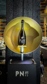 A montage video documenting a brand launch event for Bollinger Champagne at the venue JUL'S. The footage focuses on the product, the pouring process, and the guests attending the lunch event.
