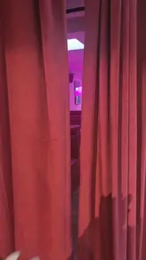 A short review and tour of Proud Mary Pizzeria, highlighting the venue's unique pink neon-lit interior, outdoor seating, and menu items including pizza, crispy potatoes, and chocolate truffles.