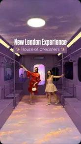 A promotional video showcasing the 'House of Dreamers' immersive experience in London. The creator walks through various themed rooms, including a ball pit, a train carriage, a flower-filled dining room, and a cloud-themed swing area, highlighting the venue's photogenic nature.