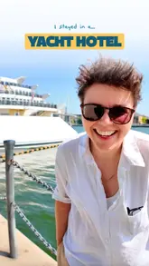 A travel vlog reviewing the Sunborn London Yacht Hotel, highlighting the unique experience of staying on a yacht in London and demonstrating how to use the Vio app to find better hotel prices.