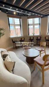 A clean, straightforward tour of a new Vietnamese coffee shop in Nottingham, highlighting the interior design, seating arrangements, and menu offerings.