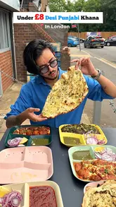 A fast-paced, energetic food review of a Punjabi takeaway spot in London, highlighting affordable dishes like Chaap Butter Masala, Paneer Makhanwala, and various naans.