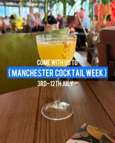 A promotional image for Manchester Cocktail Week featuring a single cocktail in a coupe glass on a wooden table, with text overlay detailing the event dates.