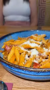 A review-style video showcasing a meal at Celino's Italian restaurant, featuring a variety of starters, mains, and desserts, with a focus on the generous portion sizes and quality of the food.