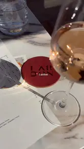 A promotional video showcasing Lardon restaurant in the Cotswolds, highlighting its outdoor terrace, interior dining space, menu offerings, and weekend DJ sets.