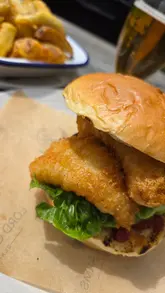A travel and food-focused reel documenting a day out in the village of Blanchland, featuring a walk, a visit to the Lord Crewe Arms for a fish finger sandwich and chips, and a stop at the White Monk Tea Rooms for cake and coffee.