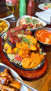 A montage showcasing the interior, bar, and various dishes at The Royal Ivy Bar & Grill, including mixed grills, curries, and naan.