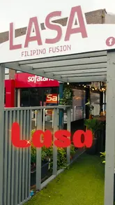 A short, music-led montage showcasing the interior and exterior of a Filipino fusion restaurant, featuring shots of the dining area, various dishes, and a cocktail being prepared.