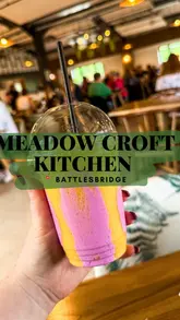 A vlog-style video showcasing a visit to Meadow Croft Kitchen, a cafe located within a garden centre, following its reopening. The video features shots of the menu, the interior, and various breakfast dishes including pancakes and savoury breakfast plates.