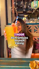 A promotional video reviewing the bottomless brunch experience at Turtle Bay, featuring a variety of cocktails, small plates, and main dishes like jerk chicken. The creator highlights the value and the atmosphere of the venue.