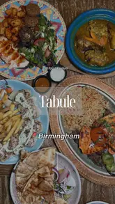 A food review video showcasing a variety of Lebanese dishes at Tabulé, including mezze platters, tagines, and drinks, set to music with text overlays identifying the venue.