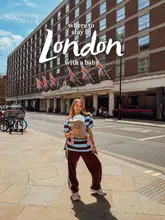 A lifestyle-focused travel shot featuring a creator with a baby in a carrier, standing in front of the Churchill Hyatt Regency in London. The image serves as a recommendation for family-friendly accommodation in the city, utilizing clear text overlay to establish the context.
