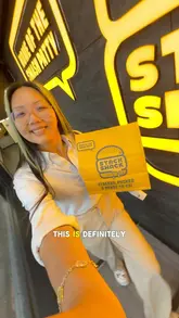 A creator visits Stack Shack to review their new menu items, specifically the paratha smash burger, injected buffalo wings, and a cola shake. The video features close-up shots of the food, the creator's reaction, and brief glimpses of the venue interior.
