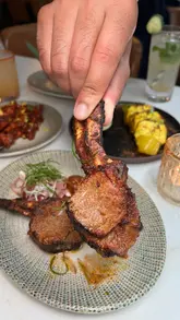 A review of Chatora City, an Indian restaurant in London, highlighting their modern Indian dishes like lamb rack, paneer tikka, and halibut curry, alongside their extensive wine list.