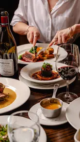 A behind-the-scenes look at professional food photography at a French restaurant, showcasing the lighting setup and the resulting high-quality food shots.