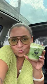 A creator reviews various matcha drinks and a gluten-free brownie from Mori Matcha, a small business in Hounslow. The video features the creator in a car, showcasing the drinks, discussing the menu, and providing personal recommendations.