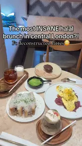 A short-form video review of a brunch spot in Covent Garden, London, highlighting specific menu items like the short rib focaccia and deconstructed tiramisu latte. The video uses a first-person perspective to showcase the food and the cafe's interior.