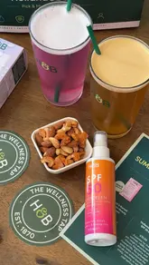 A promotional reel for the Holland & Barrett 'Wellness Tap' popup, showcasing a selection of health and wellness products alongside drinks and snacks in a pub-style setting.