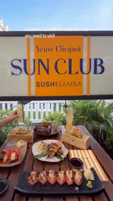 A short, aesthetic montage showcasing a summer terrace experience at SUSHISAMBA, featuring close-ups of cocktails, sushi, and various small plates in an outdoor setting.