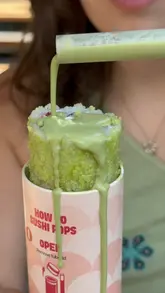 A promotional video for 'Sushi Pops' in London, featuring a unique sushi-in-a-tube concept. The video highlights the ordering process at a kiosk, the variety of options including a limited-time Wimbledon-themed dessert sushi, and provides a discount code for viewers.
