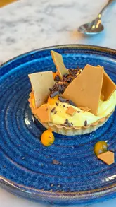A promotional reel showcasing the summer menu at Tir a Môr restaurant within St David's Hotel in Cardiff Bay, featuring shots of the exterior, interior, cocktails, and various plated dishes.