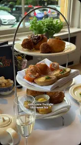 A polished reel showcasing the 'Twilight Afternoon Tea' at The Milner York, featuring a variety of savoury and sweet treats, prosecco, and live piano music in an elegant setting.