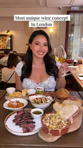 The video features a creator visiting the newly opened Vagabond Soho, showcasing their unique self-pour wine machines with over 140 options. The creator highlights the experience of tasting different wines and pairs them with a selection of small plates, including a charcuterie board, baked camembert, and steak. The video also mentions a lunch offer.