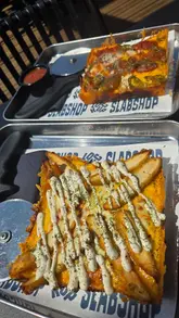 A short, casual vlog-style video showcasing a sunny day out at The Lockup in Ouseburn, featuring Detroit-style pizza from Slabshop. The video includes shots of the outdoor seating area, the Quayside, and close-ups of the pizza and drinks.