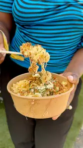 A high-energy vlog documenting a day at the British Grand Prix at Silverstone, focusing on the 'Cargo Global Eats Village' street food offerings alongside the racing and live music entertainment.
