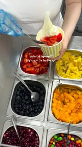 A short, visually appealing montage showcasing the preparation of a frozen yogurt cup with various toppings and a matcha drink at Kefiyo in Leeds.