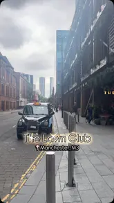 A creator visits The Lawn Club in Manchester with his mother, providing a brief tour of the venue's outdoor-style seating area and reviewing their lunch experience, including cocktails and burgers.