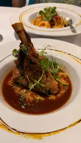 A couple visits Yiamas in Brentwood, showcasing the Greek and Mediterranean decor and a variety of dishes including mezze, lamb, and pasta.