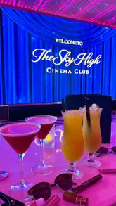 A montage video showcasing the Sky High Cinema Club at Above, featuring shots of the rooftop venue, the cinema screen, the view of the Newcastle Quayside, and the food and drink menu.