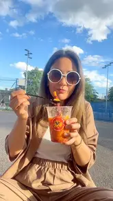 A vlog-style video capturing a casual lunch outing with family at a restaurant, featuring Indian-inspired dishes like samosas and pav bhaji, followed by a Mexican-style mango drink.