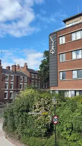 A couple documents their weekend stay at a dog-friendly aparthotel in Chester, highlighting the room amenities, the convenience of the kitchen, and the proximity to local attractions like the city walls and market.