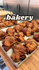The creator visits Medicine Bakery in Wolverhampton at 3:45 AM to document the early morning baking process. The video follows the staff as they prepare various pastries, including croissants and doughnuts, for distribution across the bakery's multiple sites. It concludes with the creator sampling the finished products at the cafe.