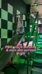A mother and son visit Junkyard Golf in Newcastle, showcasing the neon-lit mini golf courses and enjoying mocktails together.