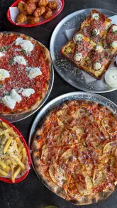 The creator presents a countdown of their top 10 pizza spots in London, featuring a variety of styles including Detroit and New York-style slices. The video uses quick cuts to showcase the food, the venue interiors, and the creator's reactions, maintaining high energy throughout.