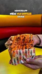 A fast-paced, music-synced montage showcasing the new Nashville-inspired menu at WingTrapp, featuring close-ups of loaded fries, chicken sandwiches, and burritos.