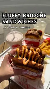 A short, energetic review of a brioche sandwich shop in Clerkenwell, featuring close-ups of the food and the exterior of the venue.