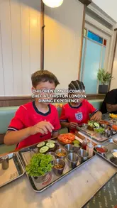 The video features children participating in a Mini Makers dining experience at Heard, where they assemble their own burgers and decorate desserts. The footage captures the interactive process, showing the ingredients, the kids at work, and the final results in a bright, casual restaurant setting.
