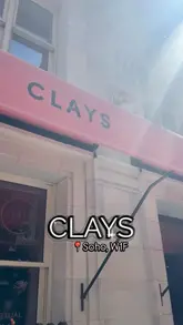 A vlog-style review of Clays in Soho, showcasing the venue's interior, food and drink offerings, and the virtual clay shooting experience.