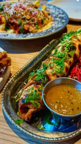 A fast-paced, curated guide to a foodie weekend in Manchester, featuring a variety of venues including street food spots, a hotel, a rooftop bar, and a Michelin-starred restaurant.