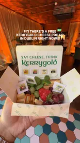 A short, fast-paced video showcasing a Kerrygold cheese pop-up event in Dublin. The video features the exterior of the venue, the interior setup, the complimentary cheese boxes being handed out, and a photo booth experience, effectively highlighting the event's offerings.