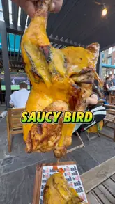 A high-energy food review featuring rotisserie chicken at The Ned Pub in Clapham. The video highlights the food, including chicken, wings, and fries, while showcasing the pub's lively atmosphere, outdoor seating, and sports screens.