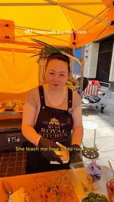 The creator visits a street food stall in Croydon to try a traditional Chinese burger, known as Rou Jia Mo. The video features an interview with the vendor, Amanda, who explains the history of the dish, followed by a demonstration of the cooking process and a taste test.