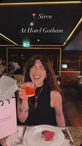 A montage video showcasing a dining experience at Siren, located within Hotel Gotham. The video features a variety of dishes, cocktails, and the restaurant's atmosphere, with the creator enjoying the meal and the event.