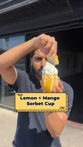 A promotional video showcasing the preparation and serving of lemon and mango sorbet cups at Lahori Lane in Manchester. The video highlights the fresh ingredients and the option to add soft-serve ice cream, directing viewers to the Sumo Eats app for purchase.