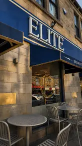 A montage-style video showcasing a variety of brunch items, including Turkish eggs, sandwiches, salads, French toast, and various iced drinks at Elite Cafe & Patisserie.
