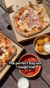 A montage video showcasing a visit to Haigh Hall, featuring the grounds, an immersive light projection experience, and food and drinks at Two Left Feet Tap.